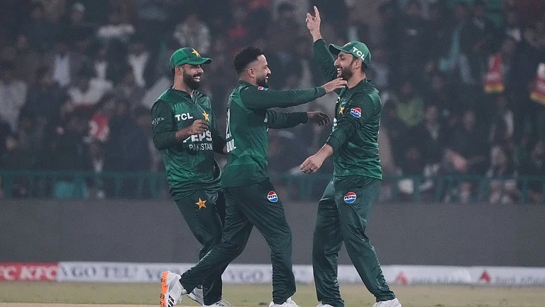 Pakistan's Mohammad Nawaz, centre, celebrates with teammates after taking the wicket of Australia's Cameron Green during the third T20I in Lahore. - Photo: AP