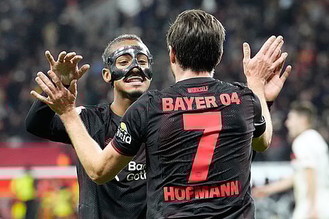 Leverkusen's Jonas Hofmann and Leverkusen's Arthur celebate after scoring during a DFB Pokal, German Cup quarter final soccer match between Leverkusen and St. Pauli in Leverkusen, Germany.