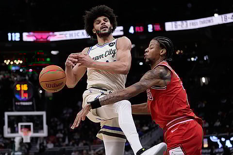 Chicago Bulls' Dalen Terry fouls Milwaukee Bucks' Andre Jackson Jr. during the second half of an NBA basketball game in Milwaukee. 