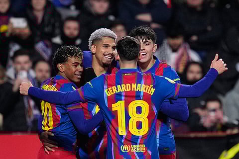 Barcelona's Ronald Araujo celebrates with team mates his side's second goal during a Copa del Rey quarterfinal soccer match between Albacete and Barcelona, in Albacete, Spain.