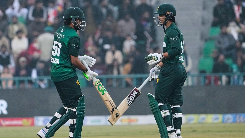 Pakistan's Babar Azam, left, and Saim Ayub bat during the third T20I against Australia in Lahore. - AP