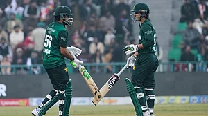 AP : Pakistan's Babar Azam, left, and Saim Ayub bat during the third T20I against Australia in Lahore.