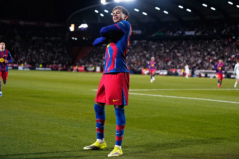 Barcelona's Lamine Yamal celebrates the opening goal during a Copa del Rey quarterfinal soccer match between Albacete and Barcelona, in Albacete, Spain. - | Photo: AP/Manu Fernandez