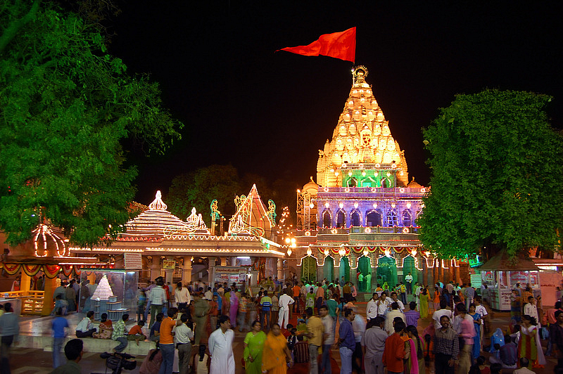 Crowds gathered at the illuminated Mahakaleshwar Jyotirlinga Temple at night in Ujjain.