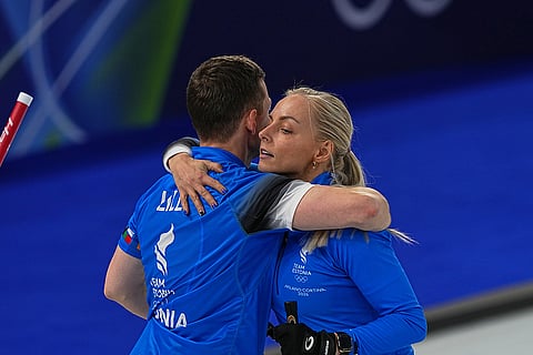 Estonia's Marie Kaldvee and Harri Lillin react, during the mixed doubles round robin phase of the curling competition against Switzerland, at the 2026 Winter Olympics, in Cortina d'Ampezzo, Italy.
