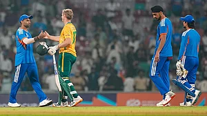 | Photo: PTI/Shashank Parade : India's captain Suryakumar Yadav and South Africa's Corbin Bosch exchange greetings after the former's team won the ICC Men's T20 World Cup warm-up cricket match against South Africa, at the DY Patil Sports Academy, in Navi Mumbai.