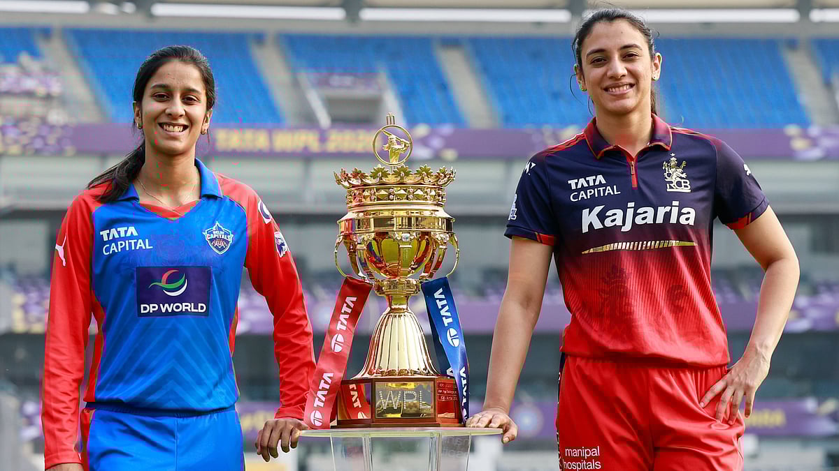 Delhi Capitals captain Jemimah Rodrigues and Royal Challengers Bengaluru captain Smriti Mandhana with the Women's Premier League trophy. - | Photo: X/wplt20