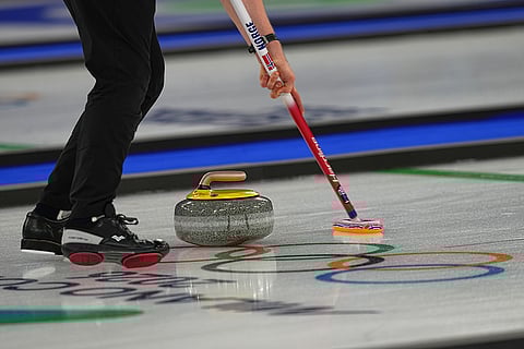 Norway's Magnus Nedregotten in action, during the mixed doubles round robin phase of the curling competition against Britain, at the 2026 Winter Olympics, in Cortina d'Ampezzo, Italy.