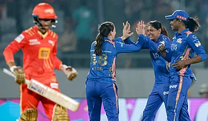 PTI : Mumbai Indians' Amelia Kerr, back left, celebrates with captain Harmanpreet Kaur, back centre, and Hayley Matthews, right, after taking the wicket of Gujarat Giants captain Anushka Sharma during a Women's Premier League (WPL) 2026