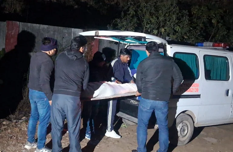 Mortal remains of the three minor sisters, who died after allegedly jumping off the balcony of their ninth floor home, being carried after post-mortem procedure, in Ghaziabad, Wednesday, Feb. 4, 2026. The minors were allegedly addicted to an online Korean game that involved a series of tasks, according to sources. - PTI