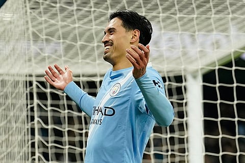 Manchester City's Tijjani Reijnders celebrates after scoringduring the English League Cup semifinal soccer match soccer match between Manchester City and Newcastle in Manchester, England.