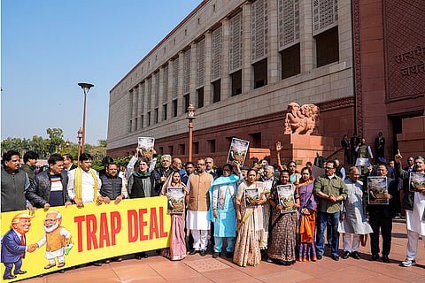 Opposition MPs stage a protest at the Parliament House complex during the Budget session, in New Delhi.