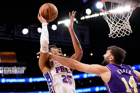 Philadelphia 76ers forward Dominick Barlow, left, shoots as Los Angeles Lakers forward Maxi Kleber defends during the first half of an NBA basketball game in Los Angeles.