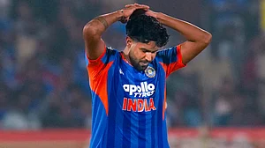 File/PTI : India seamer Harshit Rana reacts during a T20I match against New Zealand in Visakhapatnam.