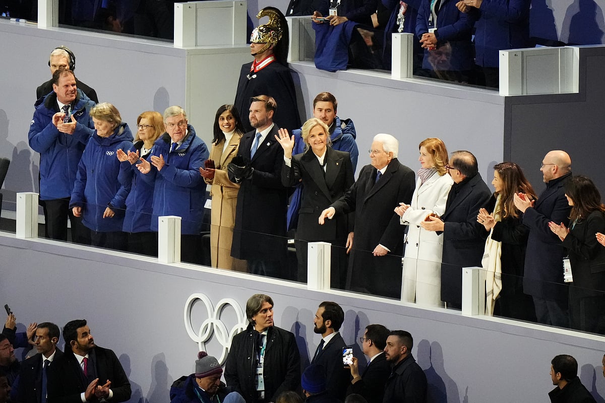IOC President Kirsty Coventry, center, waves as she stands next to former IOC president Thomas Bach, Vice President JD Vance and second lady Usha Vance and Italian President Sergio Mattarella during the Olympic opening ceremony at the 2026 Winter Olympics, in Milan, Italy, Friday, Feb. 6, 2026.