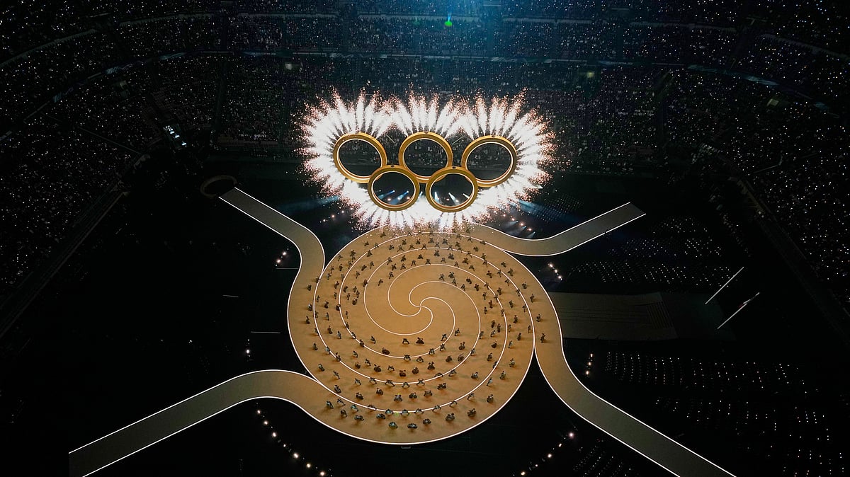 The Olympic rings are formed during the Olympic opening ceremony at the 2026 Winter Olympics, in Milan, Italy, Friday, Feb. 6, 2026.  - (AP Photo/David J. Phillip)