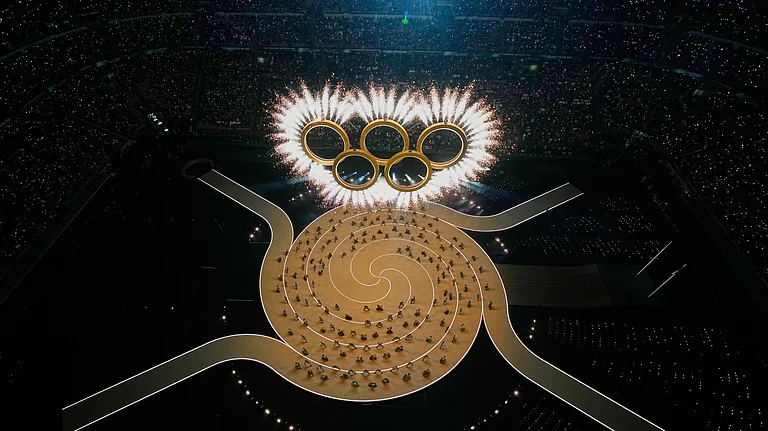 The Olympic rings are formed during the Olympic opening ceremony at the 2026 Winter Olympics, in Milan, Italy, Friday, Feb. 6, 2026. - (AP Photo/David J. Phillip)