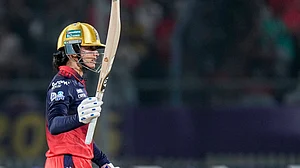 | Photo: PTI/Arun Sharma : Royal Challengers Bengaluru's captain Smriti Mandhana celebrates her half century during the Women's Premier League (WPL) 2026 final T20 cricket match between Delhi Capitals and Royal Challengers Bengaluru, at Baroda Cricket Association Stadium, Kotambi in Vadodara, Gujarat, Thursday, Feb. 5, 2026.