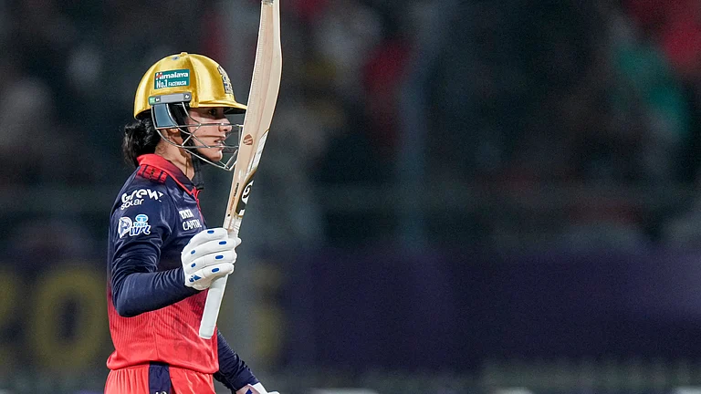 Royal Challengers Bengaluru's captain Smriti Mandhana celebrates her half century during the Women's Premier League (WPL) 2026 final T20 cricket match between Delhi Capitals and Royal Challengers Bengaluru, at Baroda Cricket Association Stadium, Kotambi in Vadodara, Gujarat, Thursday, Feb. 5, 2026. - | Photo: PTI/Arun Sharma