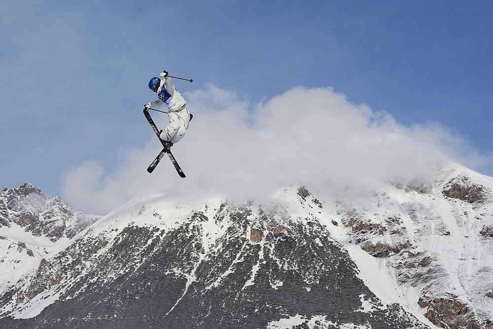 China's Eileen Gu practices during a freestyle skiing slopestyle training session at the 2026 Winter Olympics, in Livigno, Italy. - | Photo: AP/Lindsey Wasson, File
