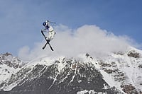 | Photo: AP/Lindsey Wasson, File : China's Eileen Gu practices during a freestyle skiing slopestyle training session at the 2026 Winter Olympics, in Livigno, Italy.
