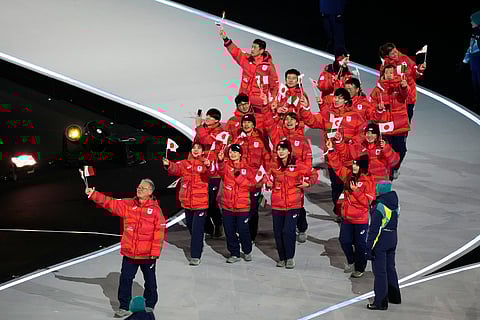 Athletes from Japan attend the Olympic opening ceremony at the 2026 Winter Olympics, in Milan, Italy, Friday, Feb. 6, 2026. 