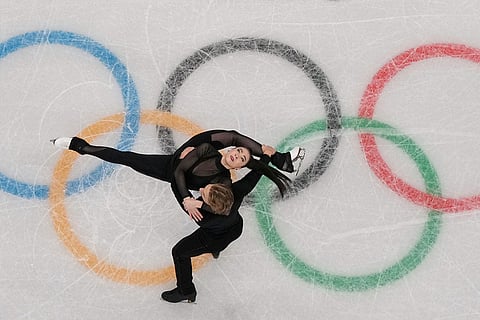 Lithuania's Allison Reed and Saulius Ambrulevicius skate during a figure skating practice session at the 2026 Winter Olympics, in Milan, Italy.