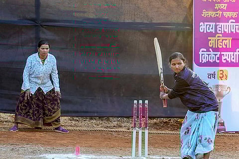 Women farmers participate in a farmers' cricket tournament, organised to mark the end of the farming season, in Pune district, Maharashtra. 