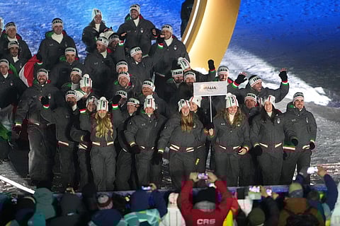 Athletes from Italy walk during the Olympic opening ceremony at the 2026 Winter Olympics, in Livigno, Italy, Friday, Feb. 6, 2026. 