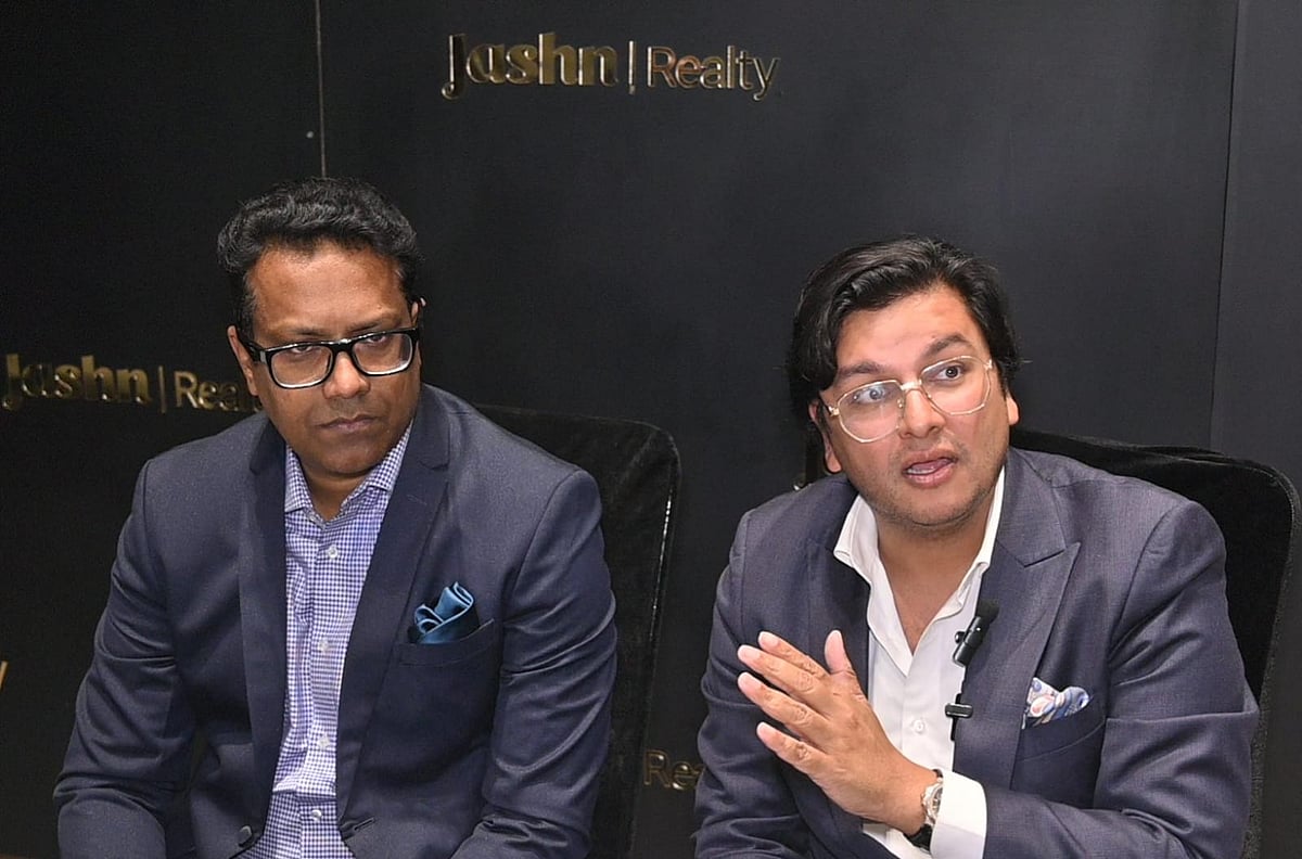 Two business leaders talking at Jashn Realty office