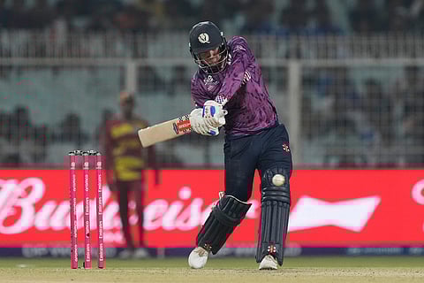 Scotland's Matthew Cross plays a shot during the T20 World Cup cricket match between Scotland and West Indies in Kolkata.