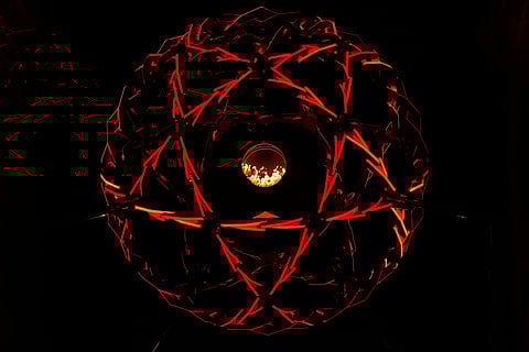 A view of the lit cauldron at the Arco della Pace during the Olympic opening ceremony at the 2026 Winter Olympics, in Milan, Italy.