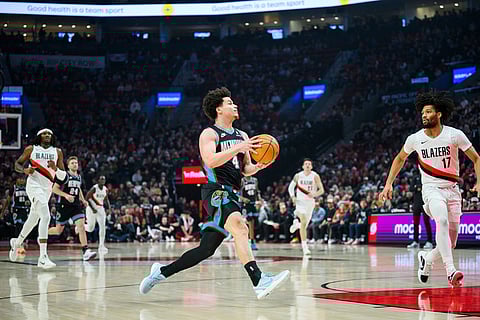 Memphis Grizzlies guard Walter Clayton Jr. (4) drives downcourt toward the basket during the first half of an NBA basketball game against the Portland Trail Blazers in Portland, Oregon.