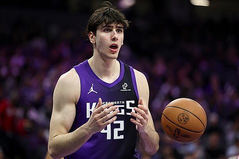 Sacramento Kings center Maxime Raynaud reacts to a foul called on him during the second half of an NBA basketball game against the Los Angeles Clippers in Sacramento, California.