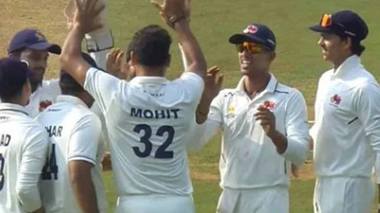 Mumbai cricketers celebrating a wicket against Karnataka. - BCCIDomestic/X