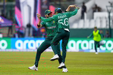 Pakistan's Babar Azam, right, and teammate Shaheen Shah Afridi celebrate after taking a co-ordinated catch to dismiss Netherlands' Michael Levitt during the T20 World Cup cricket match between Netherlands and Pakistan in Colombo, Sri Lanka.