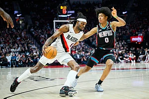 | Photo: AP/Molly J. Smith : Portland Trail Blazers forward Jerami Grant (9) dribbles around Memphis Grizzlies forward Jaylen Wells (0) in the second half of an NBA basketball game in Portland, Oregon.