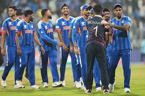 United States' captain Monank Patel shake. Hands with India's captain Suryakumar Yadav, right, after India won the T20 World Cup cricket match in Mumbai.