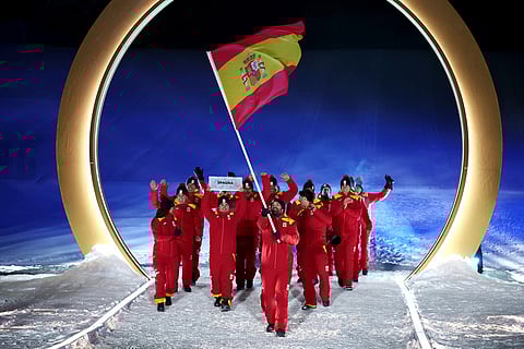 Spain's flagbearer Joaquim Salarich Baucells leads the team during the Olympic opening ceremony at the 2026 Winter Olympics, in Livigno, Italy.