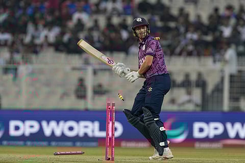 Scotland's Brandon McMullen is bowled out by West Indies' Romario Shepherd during the T20 World Cup cricket match between Scotland and West Indies in Kolkata.