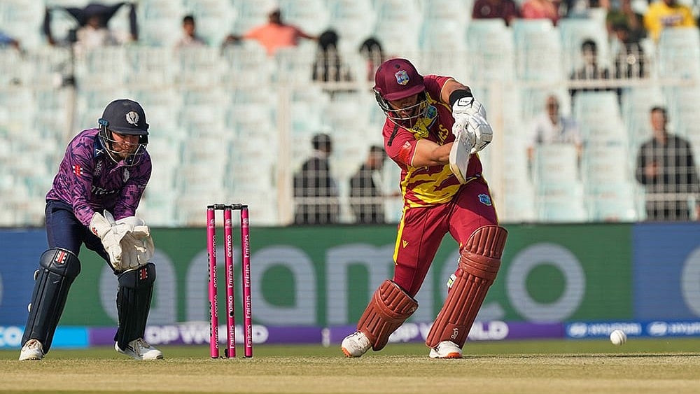 | Photo: AP/Bikas Das : West Indies' Brandon King plays a shot during the T20 World Cup cricket match between Scotland and West Indies in Kolkata.