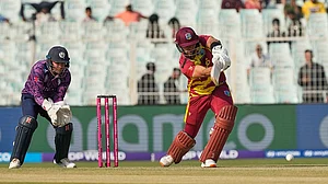 | Photo: AP/Bikas Das : West Indies' Brandon King plays a shot during the T20 World Cup cricket match between Scotland and West Indies in Kolkata.