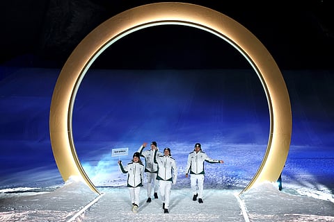 Athletes from South Africa walk during the Olympic opening ceremony at the 2026 Winter Olympics, in Livigno, Italy.