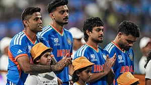 (PTI Photo/Kunal Patil)( : India's captain Suryakumar Yadav with teammates before the start of the ICC Men's T20 World Cup 2026 cricket match between India and USA, at the Wankhede Stadium, in Mumbai, Saturday, Feb. 7, 2026.