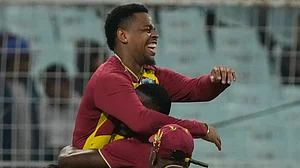 (AP Photo/Bikas Das) : West Indies' Shimron Hetmyer, left, celebrators with teammates after taking the catch to dismiss Scotland's George Munsey during the T20 World Cup cricket match between Scotland and West Indies in Kolkata, India, Saturday, Feb. 7, 2026