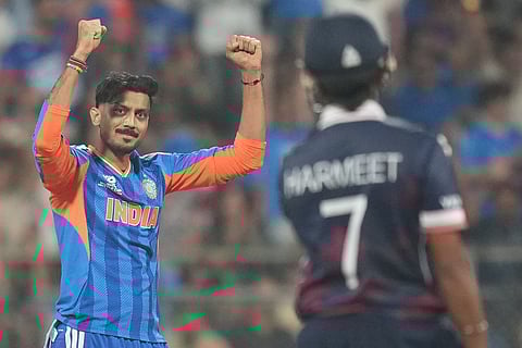 India's Axar Patel, left, United States' Harmeet Singh during the T20 World Cup cricket match between India and the United States in Mumbai.