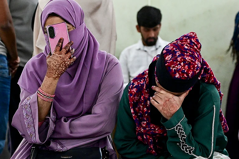 People wait during hearings under the Special Intensive Revision of electoral rolls, at a centre, in Kolkata. - | Photo: PTI