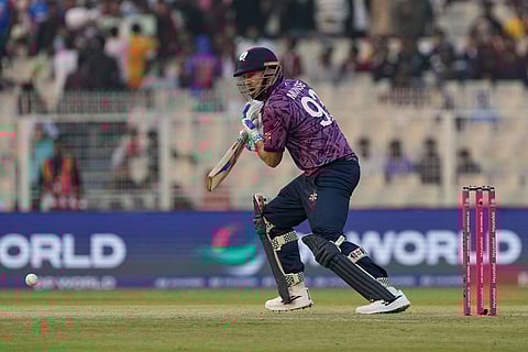 Scotland's George Munsey plays a shot during the T20 World Cup cricket match between Scotland and West Indies in Kolkata.