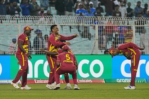 West Indies' Shimron Hetmyer, second from left, celebrators with teammates after taking the catch to dismiss Scotland's George Munsey during the T20 World Cup cricket match between Scotland and West Indies in Kolkata.