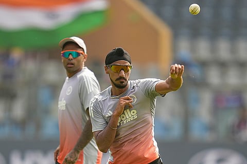 India's captain Suryakumar Yadav with teammate Arshdeep Singh during a training session ahead of the ICC Men's T20 World Cup 2026 cricket match against USA, in Mumbai.